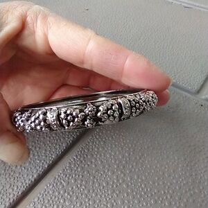Women's silvertone bangle bracelet.